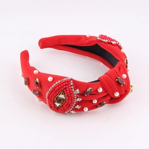 Serre-tête rouge à perles avec fleurs, strass et motif d'œil unique et élégant