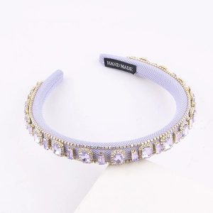 Baroque style lilac padded headband with purple gemstones and sparkling rhinestone detail