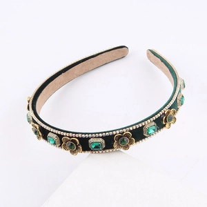 Vintage green velvet headband with gold metal flowers and emerald crystal details