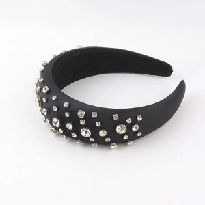 Baroque black padded headband featuring sparkling rhinestones and a wide sponge base