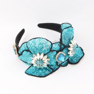 Baroque style blue sequin flower headband with rhinestone crystals on a black velvet base