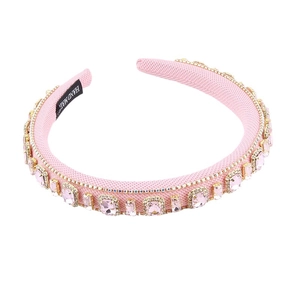 Baroque style pink padded headband featuring large crystals and sparkling rhinestones