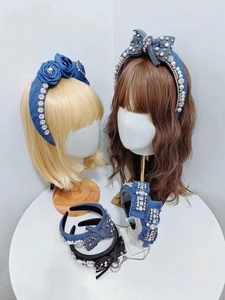 Detail of denim headbands featuring sparkling rhinestones and elegant fabric roses