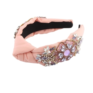 Pink knotted fabric headband with luxurious rhinestones and pearl flower embellishments