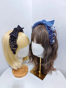 Detail of baroque denim headbands with floral sequins and rhinestone bow ornaments