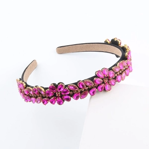 Detail of rose pink crystal floral headband with faceted rhinestones and non-slip lining