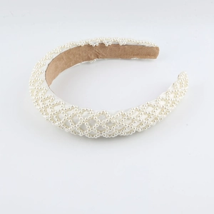 Elegant wide woven pearl headband with quilted cream satin and non-slip velvet lining