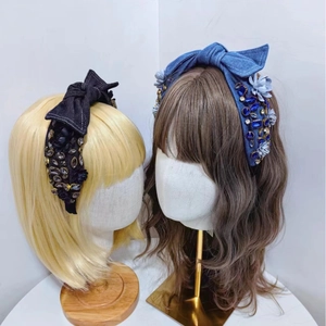 Baroque denim headband with oversized bow and colorful rhinestone floral embellishments