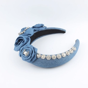 Blue denim headband featuring fabric roses with pearls and sparkling rhinestone edge