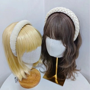 Elegant woven pearl sponge headbands for women featuring diverse bead textures on white frames