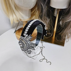 Luxurious velvet padded headband with sparkling crystal fringe and sunflower rhinestone decor