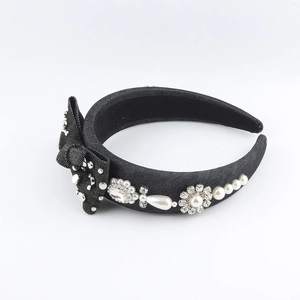 Baroque denim headband with sponge bow, rhinestones, and pearls on a wide black band