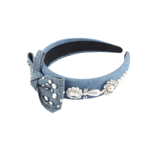 Baroque denim headband with sponge bow, rhinestones, and pearls on white background