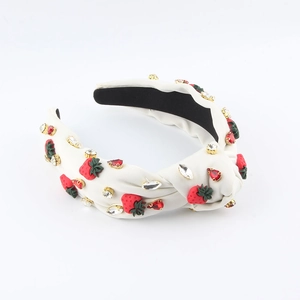 Cerchietto annodato bianco con motivi a fragola rossi e decorazioni in strass lucidi