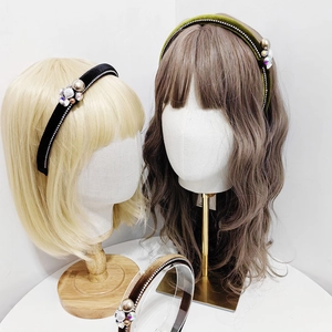Padded velvet headband with faux pearls and crystals on mannequin in three colors