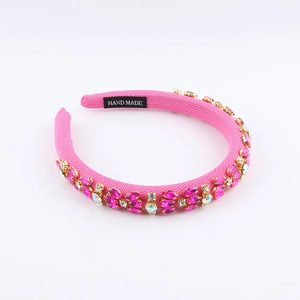 Cerchietto barocco rosa imbottito con strass scintillanti e finitura in tessuto a mano