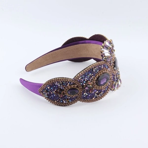 Detailed macro view of luxury purple baroque headband with crystal and rhinestone inlay