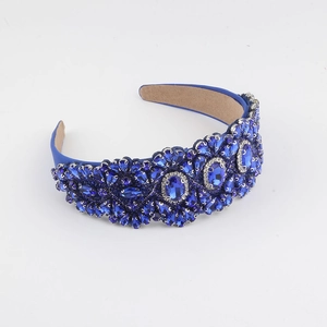 Luxurious wide headband featuring intricate blue crystals and rhinestones for women