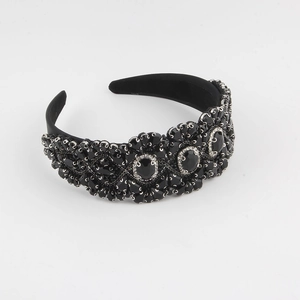 Detailed macro view of luxury black velvet headband with sparkling faceted gemstones