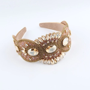 Detailed close-up of Baroque headband with amber rhinestones and champagne gold beads
