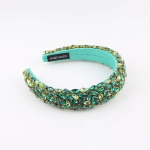 Handmade Baroque headband featuring emerald green crystals and gold metal claw settings
