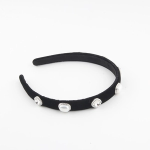 Elegant black velvet headband with pearls and rhinestones on a clean white background