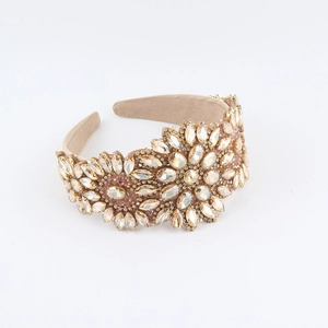 Detailed view of luxury baroque headband with champagne crystals and floral rhinestone patterns