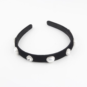 Detail of black velvet headband featuring alternating pearls and crystals with silver metal edges