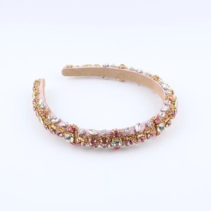 Elegant pink baroque headband with hand-sewn crystals on a padded velvet base for women