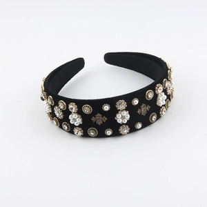 Detail of French vintage black velvet headband with pearls and rhinestones decoration