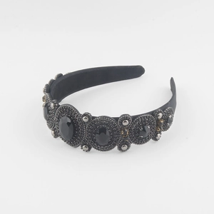 Close-up detail of Baroque headband with black gems and sparkling rhinestones