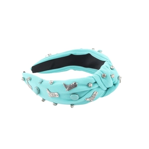 Knotted turquoise fabric headband featuring silver western boot charms and rhinestones