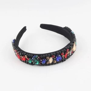 Detailed close-up of Baroque velvet headband with colorful crystals and black beads