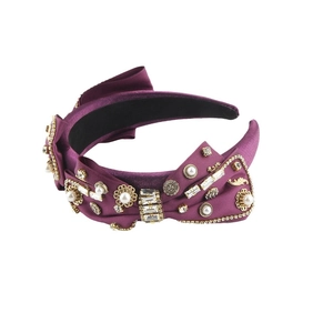 Luxurious magenta satin headband with bow design featuring rhinestones and pearls