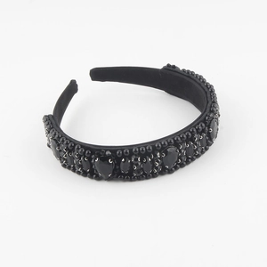 Detailed view of the black beaded headband with teardrop resin gems and embroidery