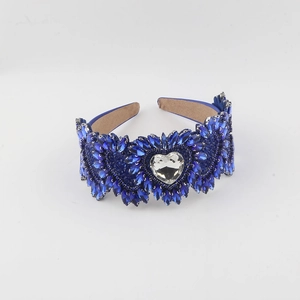 Detailed view of blue rhinestone heart headband with crystal embellishments