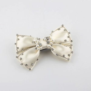 Elegant beige satin bow hair clip with pearls and rhinestone edges for women