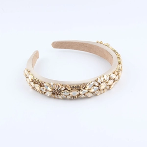 Detail of baroque headband with champagne crystals and floral rhinestone patterns