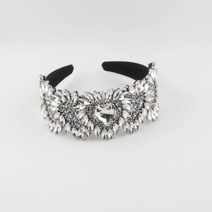 Detail of velvet headband with white crystals and a large heart-shaped diamond centerpiece