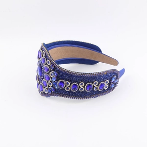 Detailed view of the dark blue luxury padded headband with crystal rhinestones