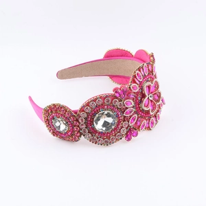Serre-tête baroque avec strass roses et cristaux sur une monture large rembourrée