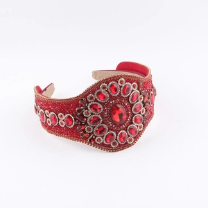 Detailed view of luxury red rhinestone headband with large oval ruby-like crystals