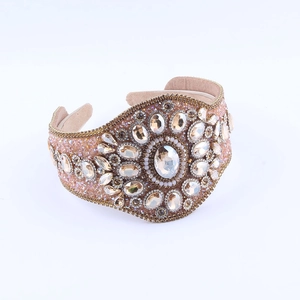 Detailed macro view of luxury baroque headband with champagne crystals and rhinestones