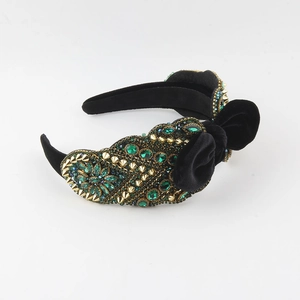 Baroque black velvet wide headband with emerald crystals, gold rivets and a large bow