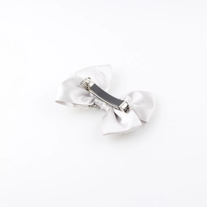 Elegant satin bow hair clip with rhinestone edges and metal clasp on white background