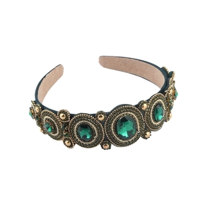 Luxury Baroque vintage headband with green gemstones and gold beads on white backdrop