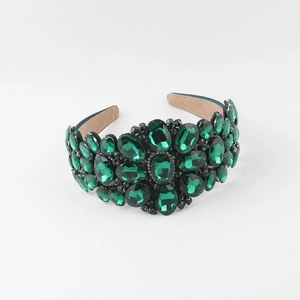 Detail of baroque headband with emerald green crystals and comfortable suede lining