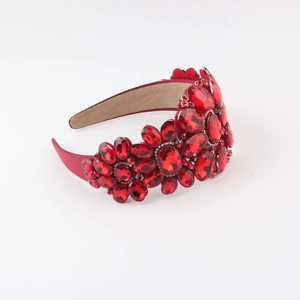 Macro detail of luxury red baroque headband with intricate glass crystal embellishments