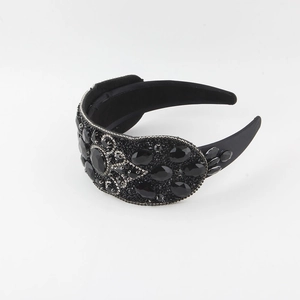 Detail of baroque wide headband with black gemstones and silver crystal rhinestones