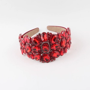 Close-up of baroque headband with red oval crystals and soft anti-slip suede lining